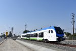 An eastbound heading to Redlands-University Station after crossing W. Colton Avenue at grade 